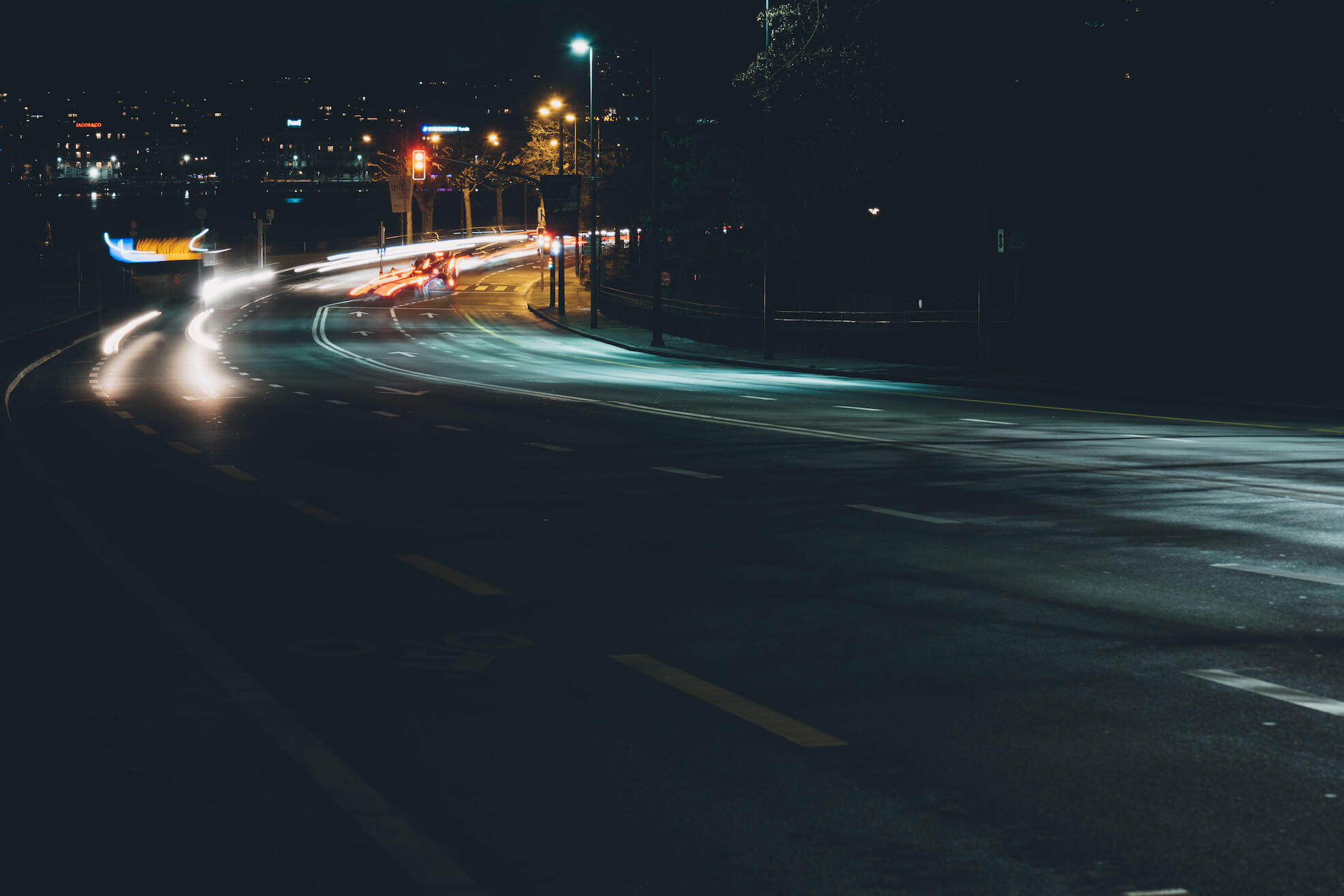 Geneva street at night with light trails