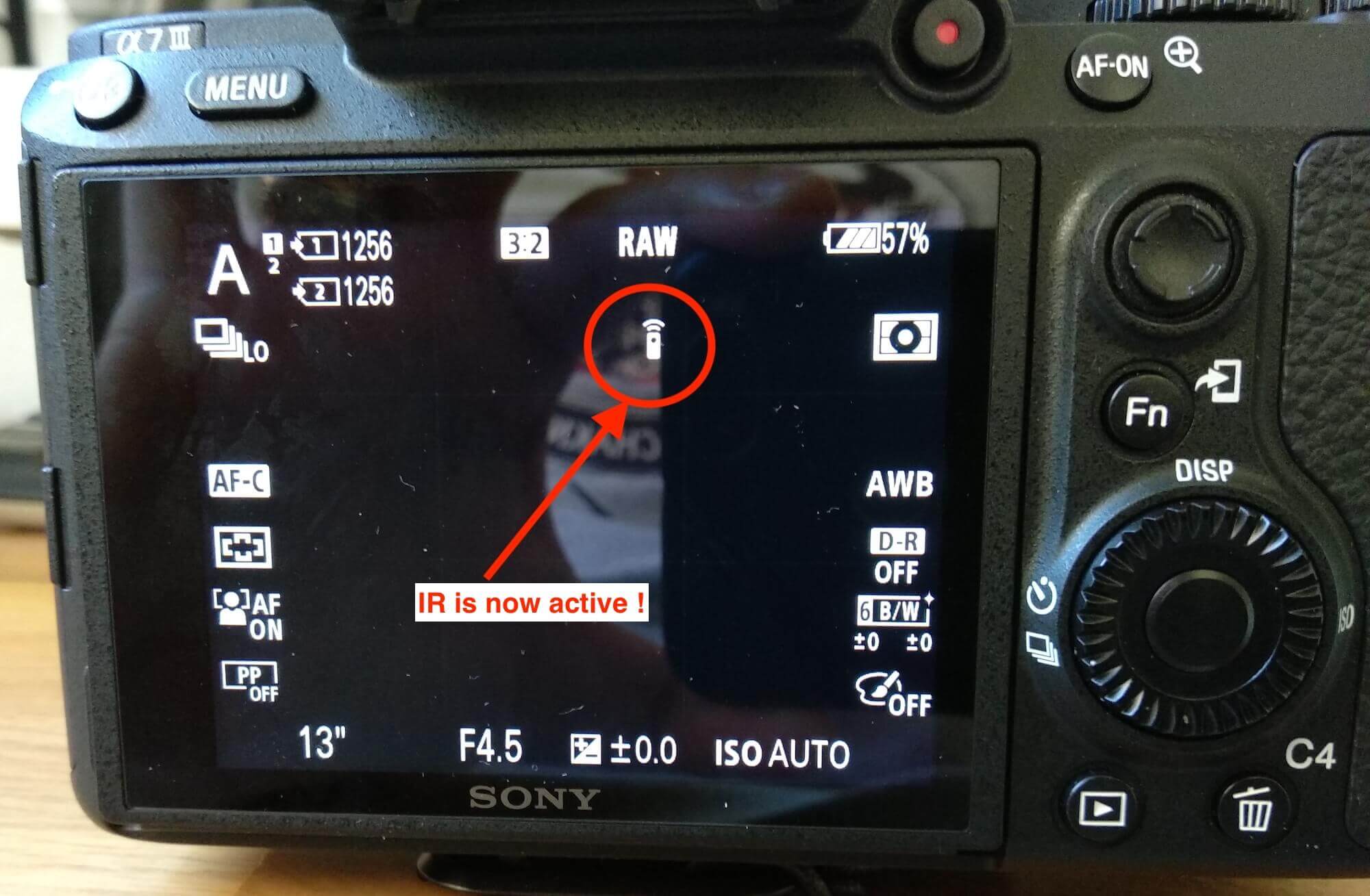 Sony a7 III camera with remote control demonstrating how to enable the IR function