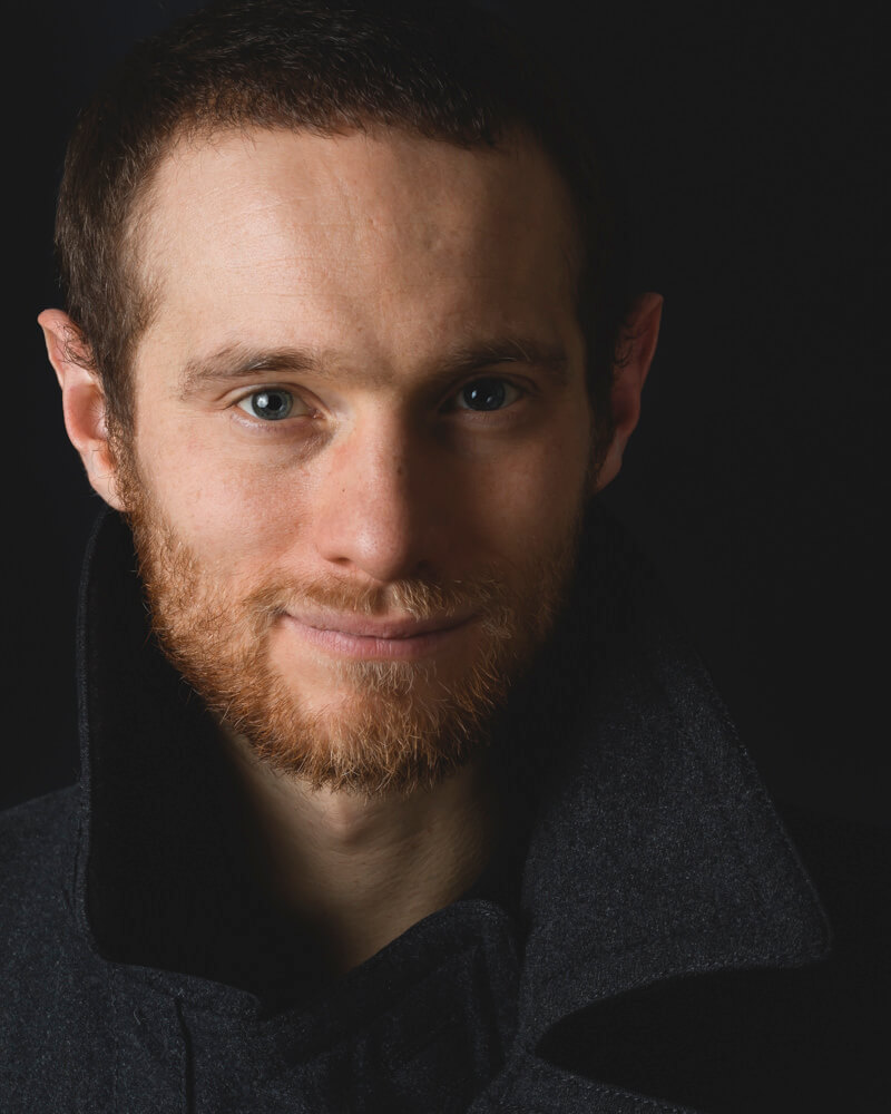 Professional audition headshot of a man in Geneva, photographed in studio lighting