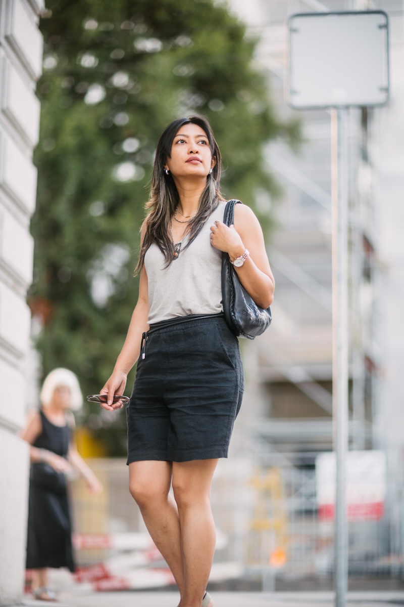 Cinematic editorial fashion shoot of a woman in the streets of Plainpalais in Geneva