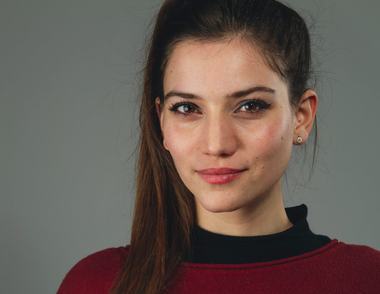 Professional corporate headshot of a woman in Geneva, photographed in studio