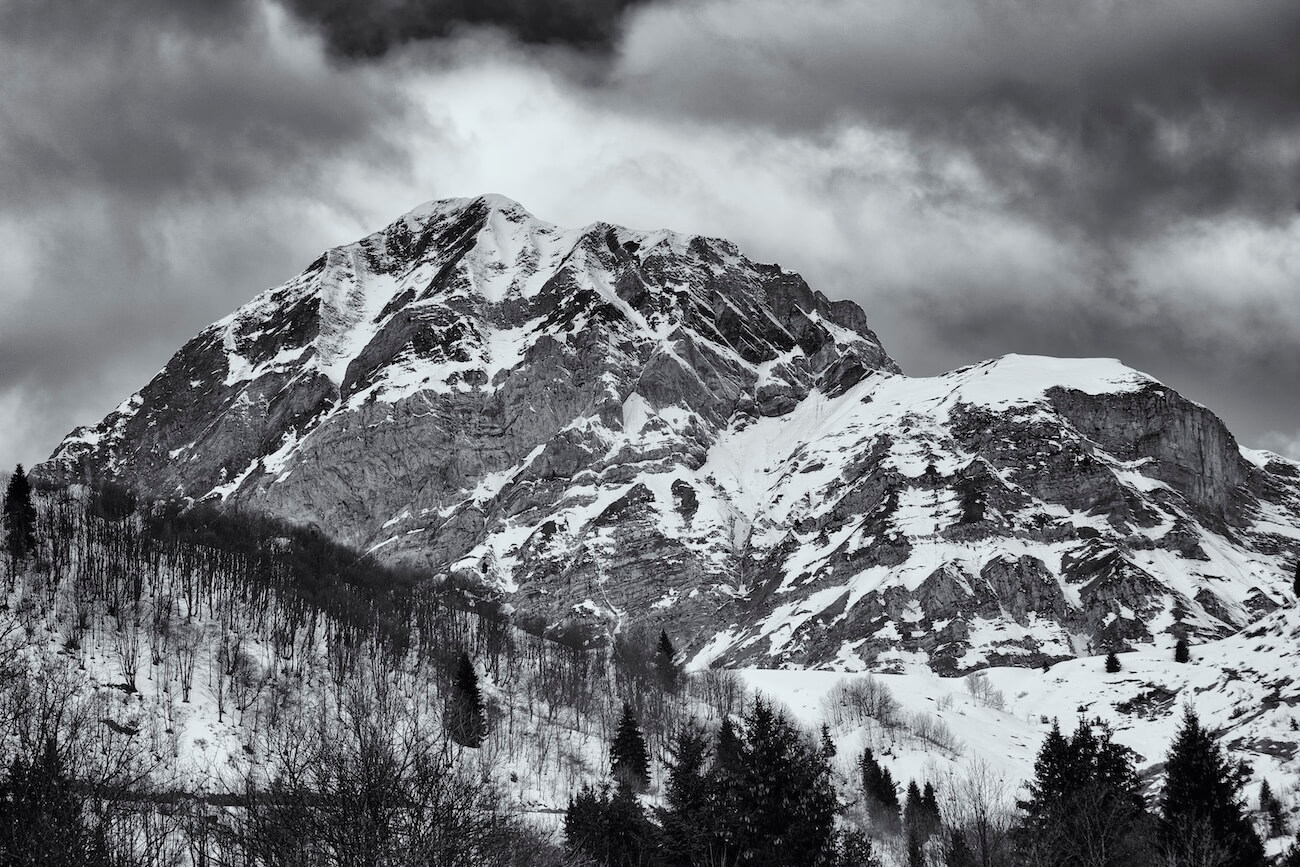 Fine art black and white photograph of a snowy mountain peak in Savoie, France, captured in timeless detail