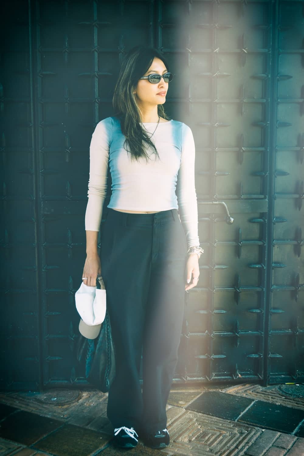 Lifestyle portrait of a woman in the streets of a village